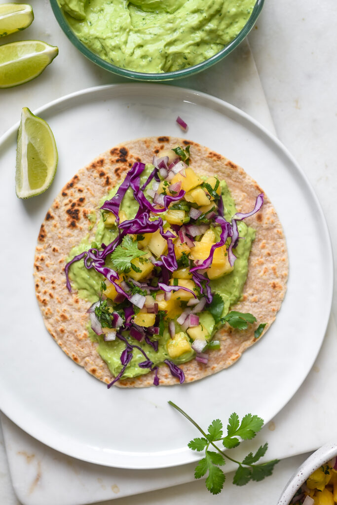 Spicy Shrimp Tacos with Mango Slaw & Avocado Crema | Nourish Deliciously